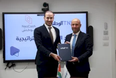 البنك الوطني يجدد التعاون مع شركة نيو كاش