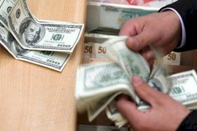 الدولار والدينار يواصلان الانخفاض