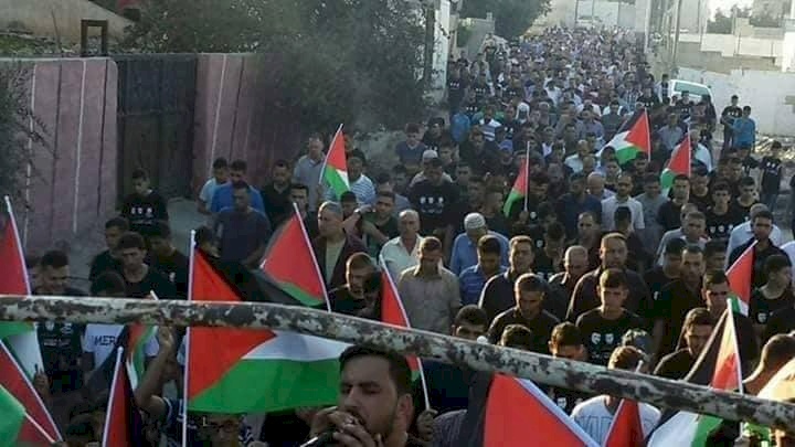 مسيرة باتجاه منازل شهداء دير ابو مشعل الثلاثة