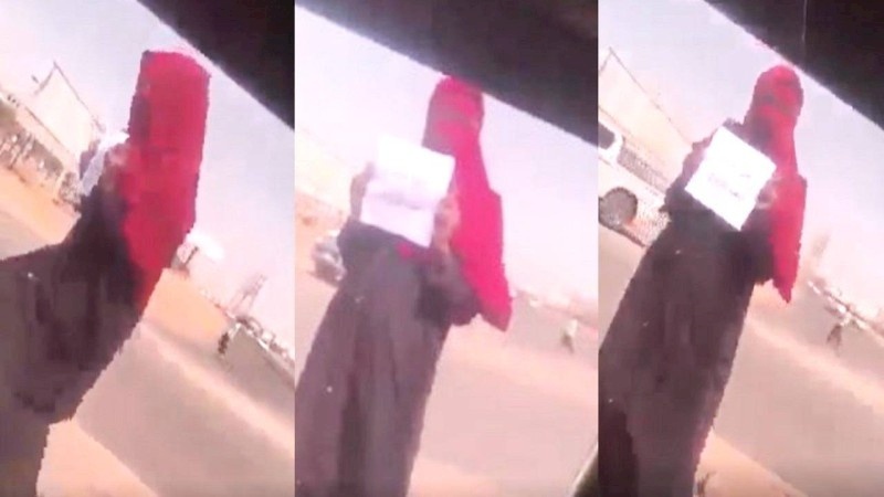 تصرف غريب من شابة سودانية يثير الجدل.. وقفت بالشارع وهذا ما حملته!